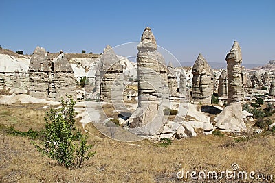 Love valley in Goreme village, Turkey. Rural Cappadocia landscape. Stone houses in Goreme, Cappadocia. Stock Photo