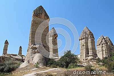 Love valley in Goreme village, Turkey. Rural Cappadocia landscape. Stone houses in Goreme, Cappadocia. Stock Photo