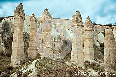 Love valley with huge phallus shape stones in Goreme village, Turkey. Rural Cappadocia landscape. Stock Photo