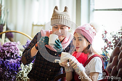 love, wedding, winter, dating and people concept - smiling couple in coffee Time. Stock Photo