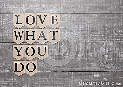 Love what you do motivation symbol on wood board Stock Photo