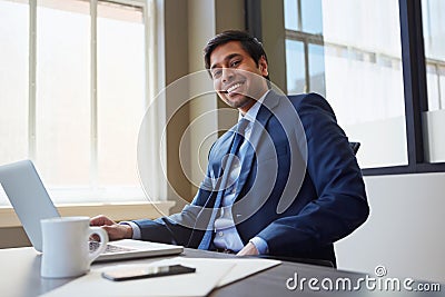 Love what you do and success will follow naturally. Cropped portrait of a businessman working in his office. Stock Photo