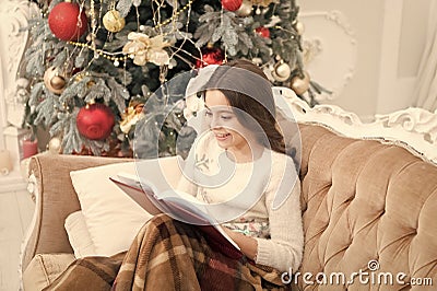 Love winter fairy tale. Our traditions. cosy evening at home. new year eve. best xmas book. small girl reader enjoy Stock Photo