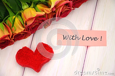 With love wishes and bouquet of gorgeous red roses Stock Photo