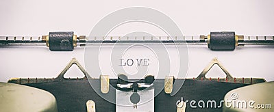 LOVE word in capital letters on a typewriter sheet Stock Photo