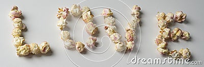 `love`written with white pink popcorn Stock Photo