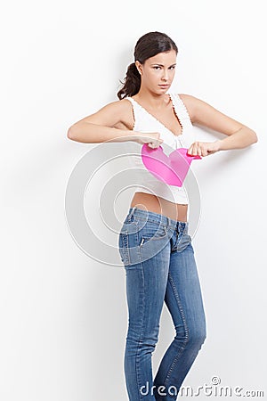 Lovelorn woman with paper heart in hands Stock Photo