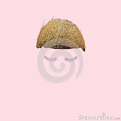 Lovely abstract coconut half with funky pair of eyelashes. Baby pink background. Optimistic minimal modern concept Stock Photo