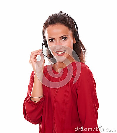 Lovely adult secretary speaking on headphones Stock Photo