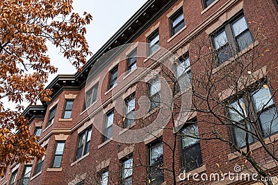 Lovely architectural details of an old brick apartment building, lentils and sills of stone, keystones Stock Photo