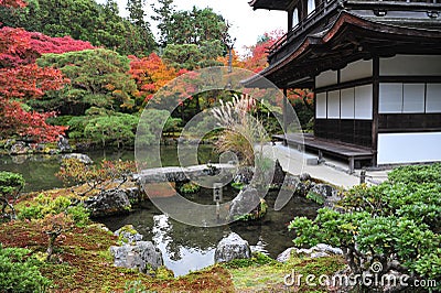 Lovely and beautiful old traditional temple in japan garden during autumn season. Stock Photo