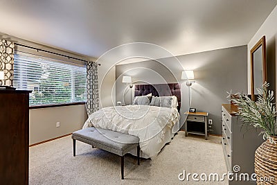 Lovely bedroom with grey accent wall Stock Photo