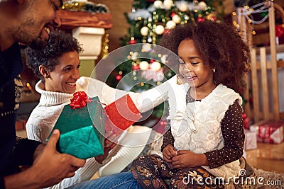 Lovely black child for Christmas with parents Stock Photo