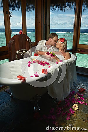 Lovely bride and groom during dream preparation and spa procedure before wedding. Stock Photo