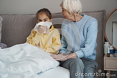 Lovely child not feeling well due to seasonal cold Stock Photo