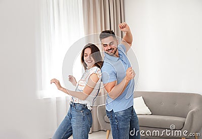 Lovely couple dancing together at home Stock Photo
