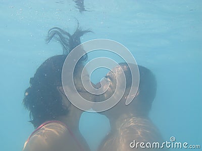 Lovely couple kissing underwater Stock Photo