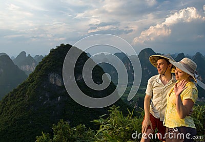 Lovely couple at sunset on top of the Chinese mountain of Moon Hill Stock Photo