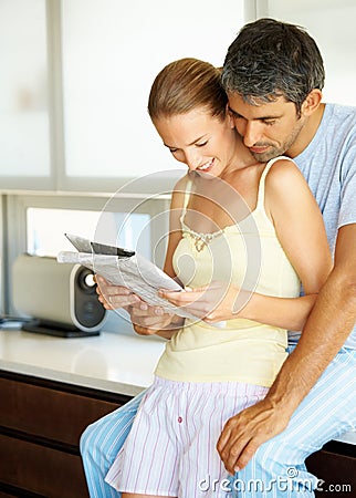 http://thumbs.dreamstime.com/x/lovely-couple-their-home-reading-newspaper-9637280.jpg
