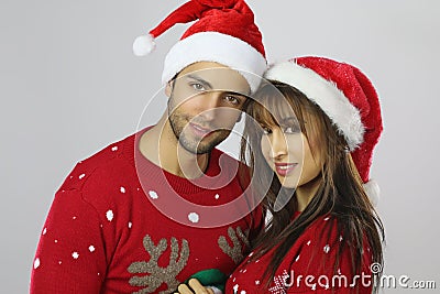 Lovely couple wearing Christmas clothes Stock Photo