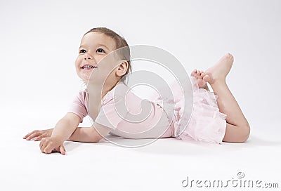 Lovely and Cute Caucasian Female Child Laying on Floor Stock Photo