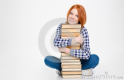 Lovely cute pretty young woman hugging books and smiling Stock Photo