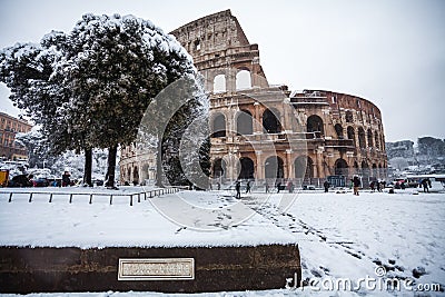 A lovely day of snow in Rome, Italy, 26th February 2018: a beautiful view of Colosseum under the snow Editorial Stock Photo