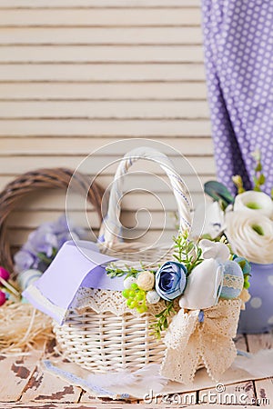 Lovely Easter eggs basket, adorned with flowers Stock Photo