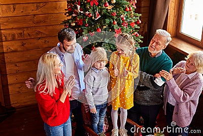 Lovely family clapping hands for child boy Stock Photo