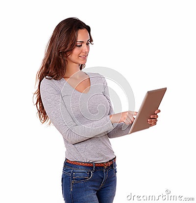 Lovely hispanic woman working on tablet pc Stock Photo