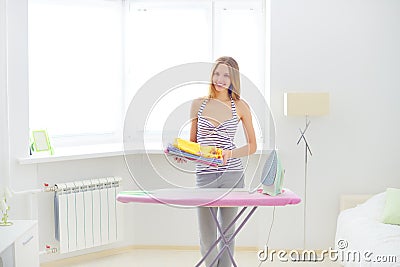 Lovely housewife with clothes Stock Photo