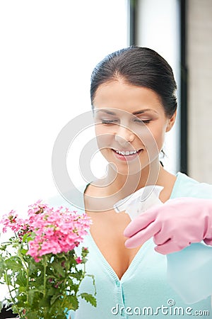 Lovely housewife with flower Stock Photo