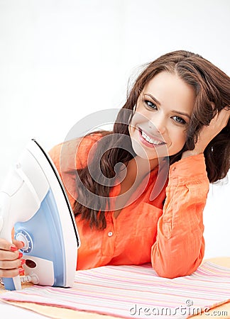 Lovely housewife with iron Stock Photo