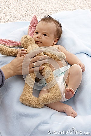 Lovely infant with plush bunny Stock Photo