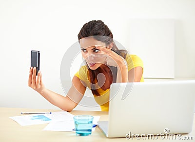 Lovely latin secretary taking a selfie Stock Photo