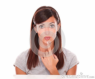 Lovely latin woman asking a question Stock Photo