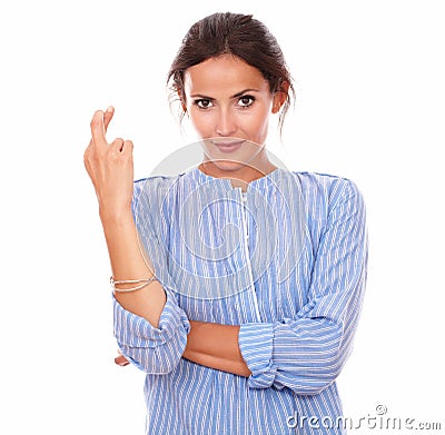 Lovely latin woman crossing her fingers Stock Photo