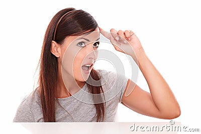 Lovely latin woman pointing to her head Stock Photo