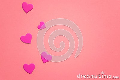 Lovely magenta hearts on pink paper table. Copy space Stock Photo