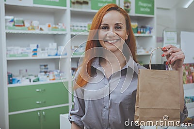 Beautiful woman shopping at the pharmacy Stock Photo