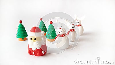 Lovely merry chritmas and happy new year with santa claus doll,christmas tree and his reindeer isolated on white background. Stock Photo