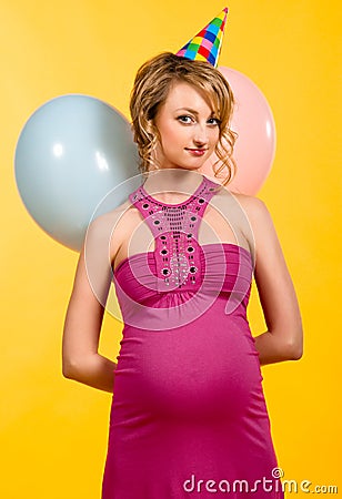 Lovely pregnant young woman with balloons Stock Photo