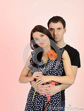 Lovely romantic couple with flower Stock Photo