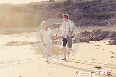 Lovely senior mature couple on their 60s or 70s retired walking Stock Photo