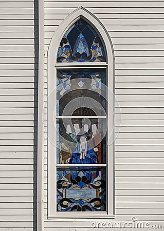 A lovely stained glass window at the Immaculate Conception Catholic Church in the City of Jefferson, Texas. Stock Photo