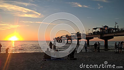 Sunset at lovely sand beach with beautiful sky Stock Photo