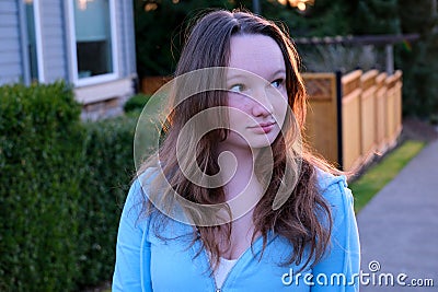 Lovely tanned woman posing in fashionable apparel at the street Stock Photo