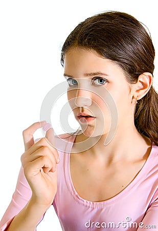 Lovely teen girl with pill Stock Photo