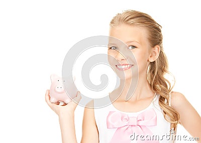 Lovely teenage girl with piggy bank Stock Photo
