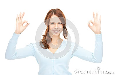 Lovely teenage girl showing ok sign Stock Photo